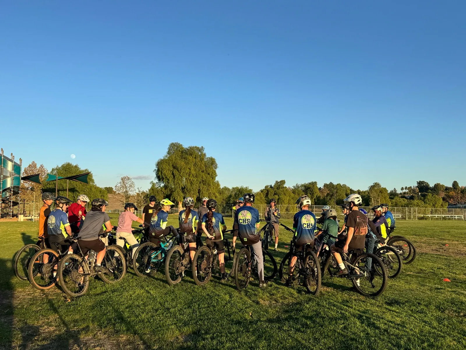 The Chaparral MTB team gathered on their bikes at golden-hour practice